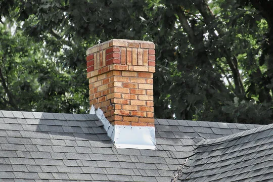 Two-tone brick chimney with flashing